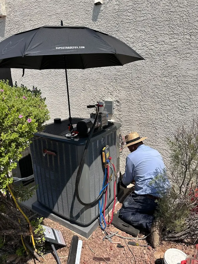 HVAC technician performing outdoor AC maintenance in Alsip
